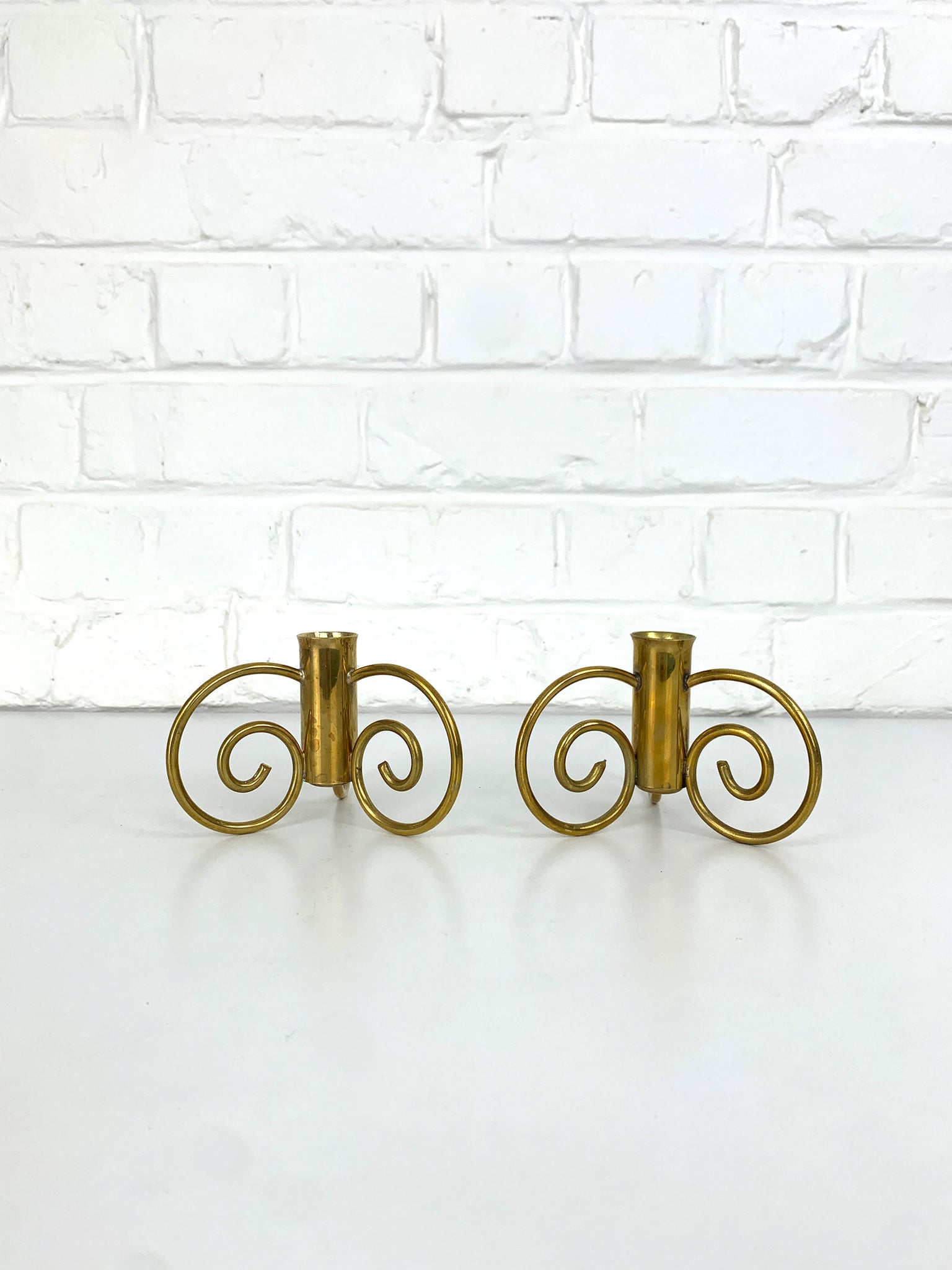 Pair of Swedish Modern Brass candle-sticks by Lars Holmström for Svenskt Tenn, Sweden, 1950
