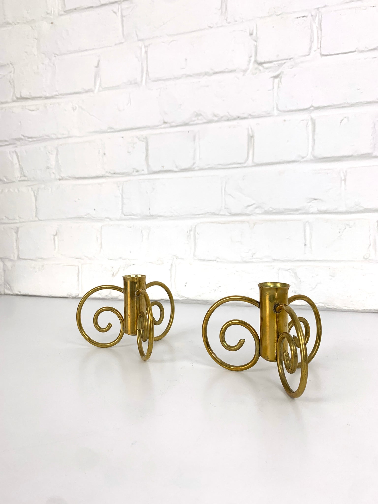 Pair of Swedish Modern Brass candle-sticks by Lars Holmström for Svenskt Tenn, Sweden, 1950
