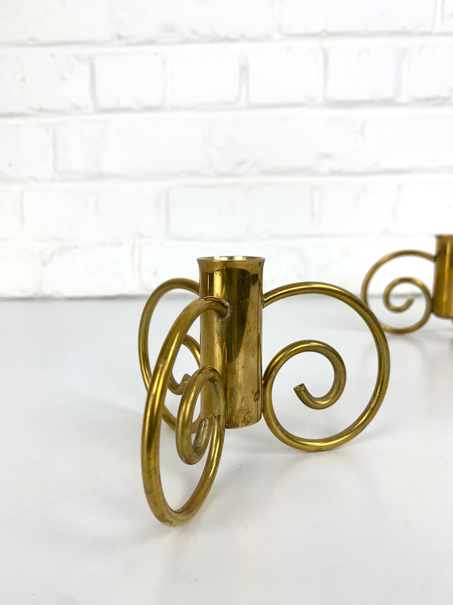 Pair of Swedish Modern Brass candle-sticks by Lars Holmström for Svenskt Tenn, Sweden, 1950