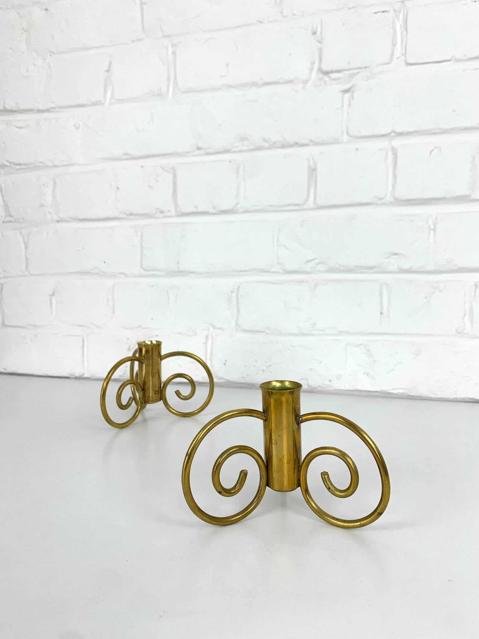 Pair of Swedish Modern Brass candle-sticks by Lars Holmström for Svenskt Tenn, Sweden, 1950
