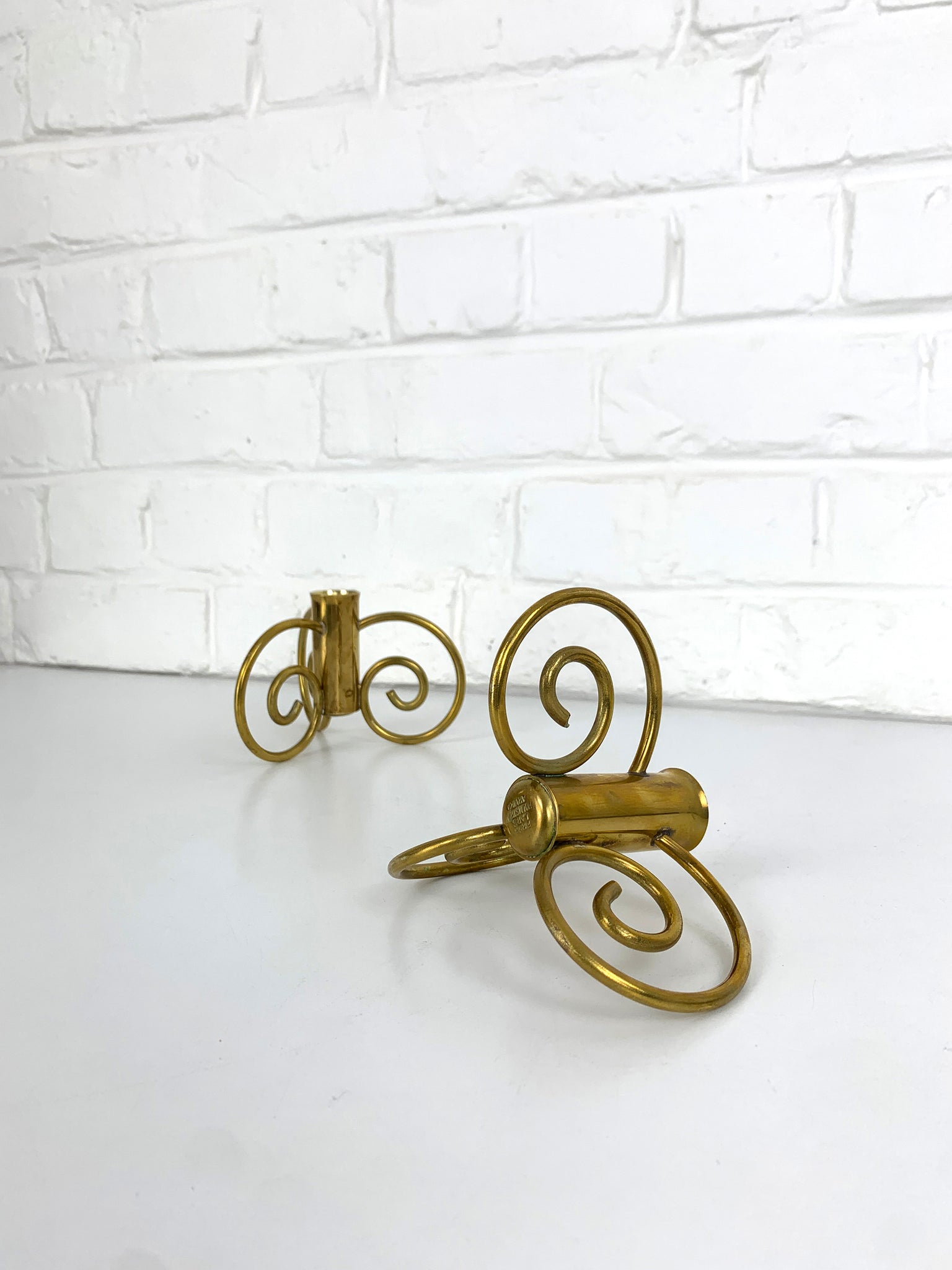 Pair of Swedish Modern Brass candle-sticks by Lars Holmström for Svenskt Tenn, Sweden, 1950